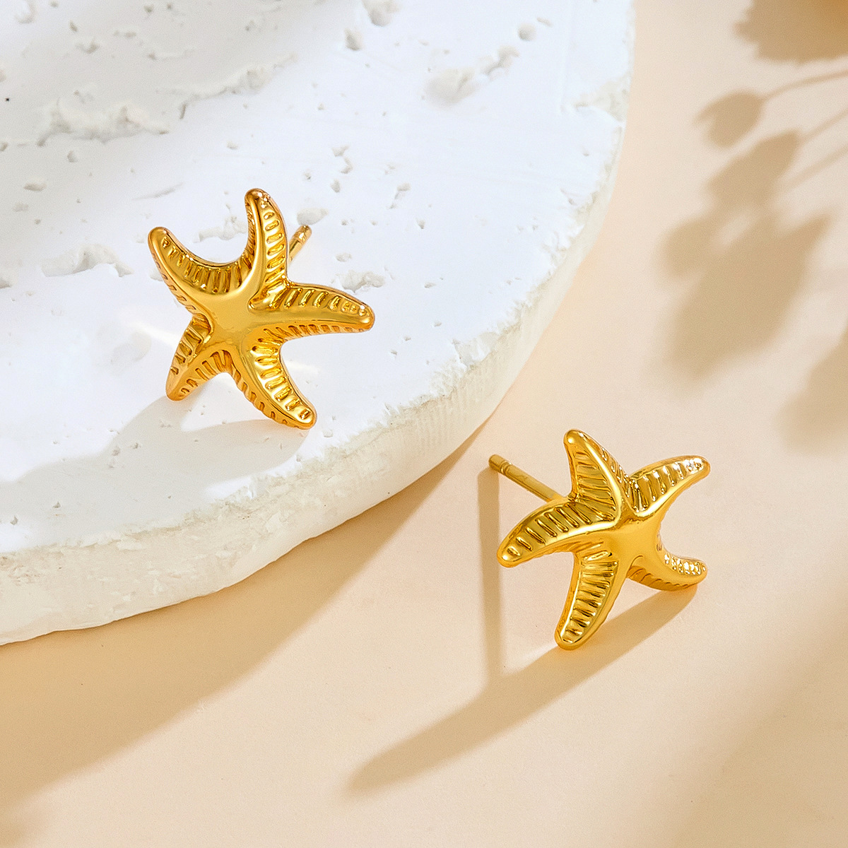 亚马逊新款高级感不锈钢耳饰跳舞海星耳钉女小众百搭钛钢耳环批发