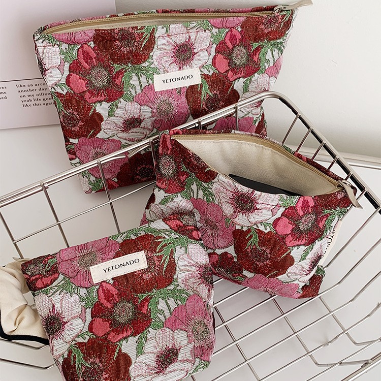 新款高级感文艺提花化妆包女士花朵手拿包高颜值便携收纳包零钱包