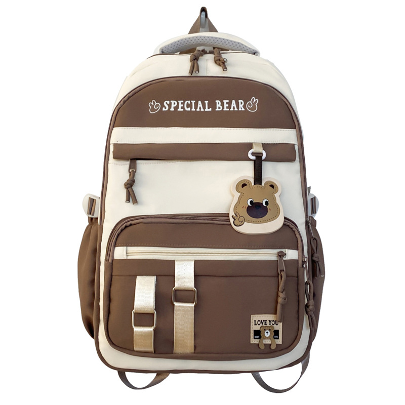 批发新款初高中学生大容量书包轻便减负背包小学生简约结实双肩包白底实物图