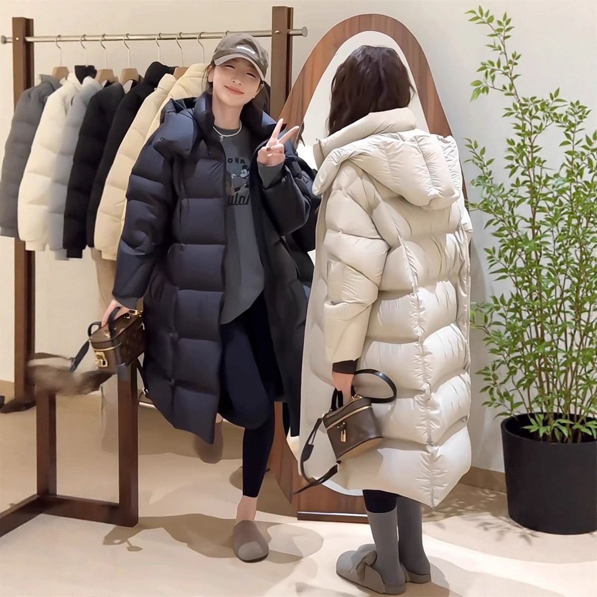 This new long down jacket for women in 2025 is loose and slimming. It features thick white duck down and is a bestseller with a strong design sense for petite women details Picture