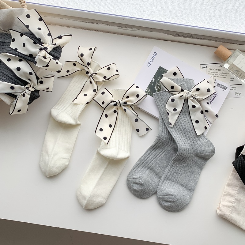 One-piece delivery service for new spring and autumn products from sock stalls: jk girls' bamboo and cotton double-needle bow accessory socks, Japanese-style ins trendy solid color mid-calf socks