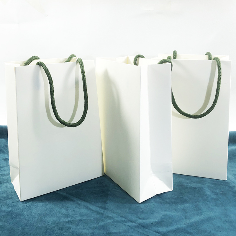 新款梯形个性珠宝手提袋四叶草同款白色纸袋V底加厚高级感首饰袋