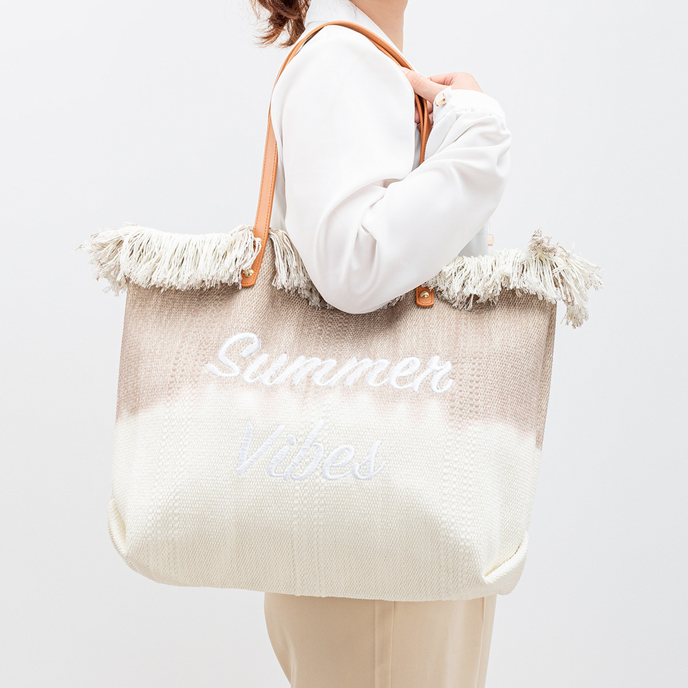 Embroidered tote bag, commuter magnetic buckle handbag, seaside vacation underarm bag, new women's beach single-shoulder canvas bag Specification image