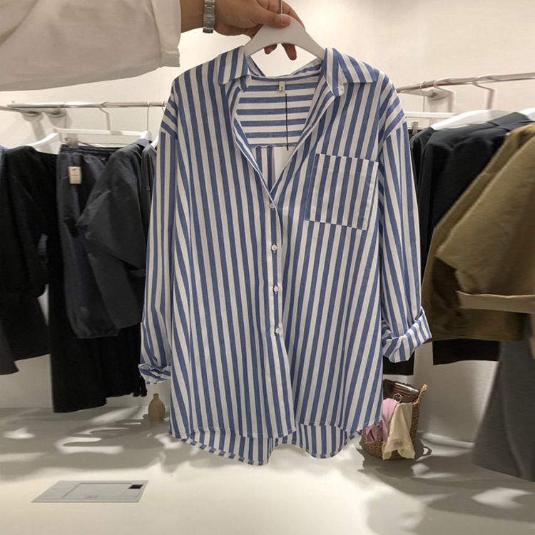 The new spring 2023 collection of the blue striped shirt with a unique design sense for women, featuring loose vertical stripes and a retro Hong Kong style Specification image