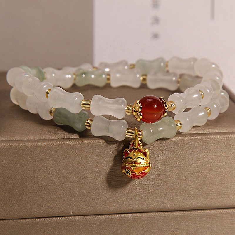 The golden silk jade double-ring bamboo joint bracelet for women on Instagram is a niche, light luxury, and high-end charm that keeps rising. It's a Maneki Neko pendant bracelet Specification image