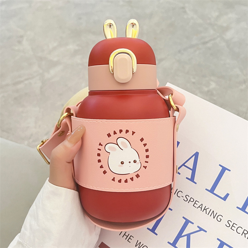 Wholesale of high-appeartion-level insulated cups for the Year of the Rabbit, children's stainless steel portable creative drinking cups for boys and girls, portable shoulder straps Application Scenario