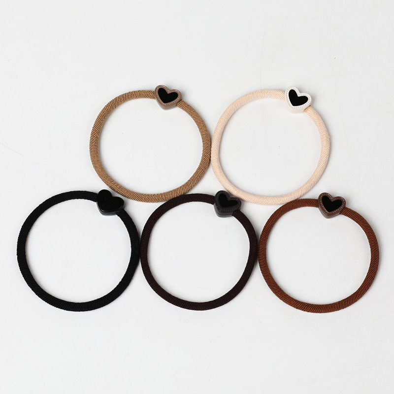 A new, stylish and simple hair band in milk coffee color, a heart-shaped Korean hair accessory that won't damage hair, a hair tie, a ponytail, and a leather band for women details Picture