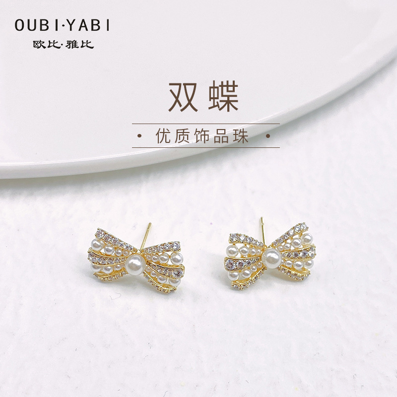 Obi new S925 silver needle pearl bow zircon advanced sense earrings fashion temperament sense female earrings niche full figure