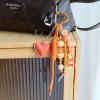 Roman-style heavy industry three-dimensional cotton-filled leather heart orange miu series hand-woven vacation bag pendant Specification image
