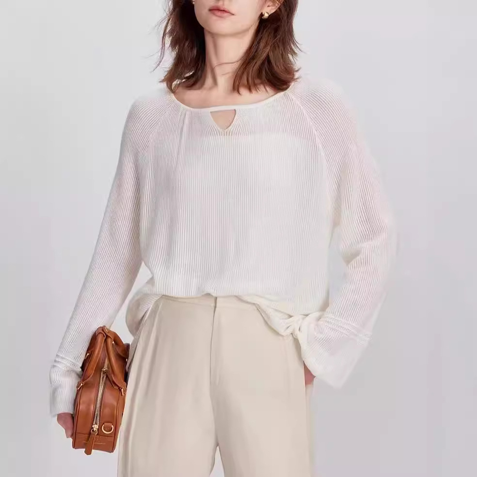 ELLE's new Summer 2024 collection of loose, soft and thin woolen sweaters featuring a blend of wool and satin with a round neck