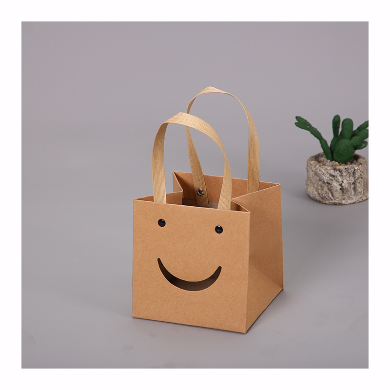 The New Kraft Paper Bag Wholesale Creative Design Smiley Face Tote Bag Go Out Jewelry Storage Convenient Packaging Box Item Picture