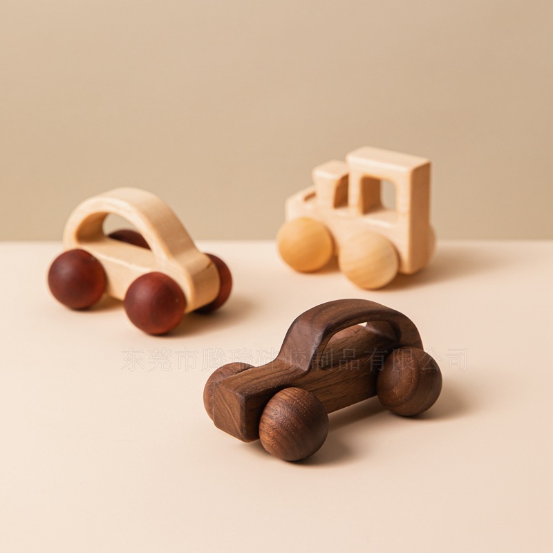 A three-piece set of high-end wooden toy cars for children, including a wooden handcart, a hand-held inertial trolley, and a children's grasping and educational toy details Picture