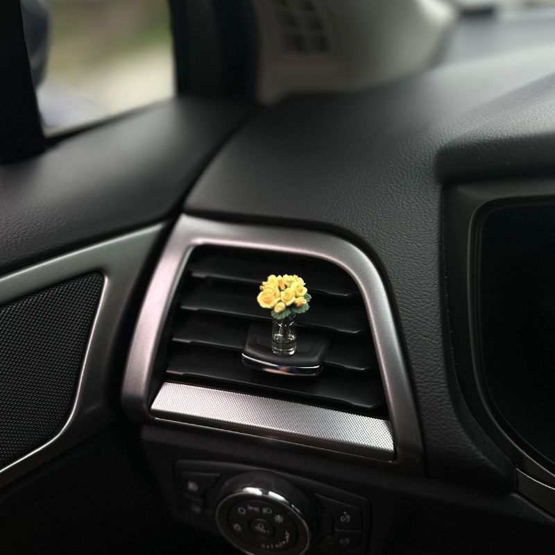 The charming rose-shaped car center console window decoration is a mini car accessory, making it unique and beautiful for ladies inside the car