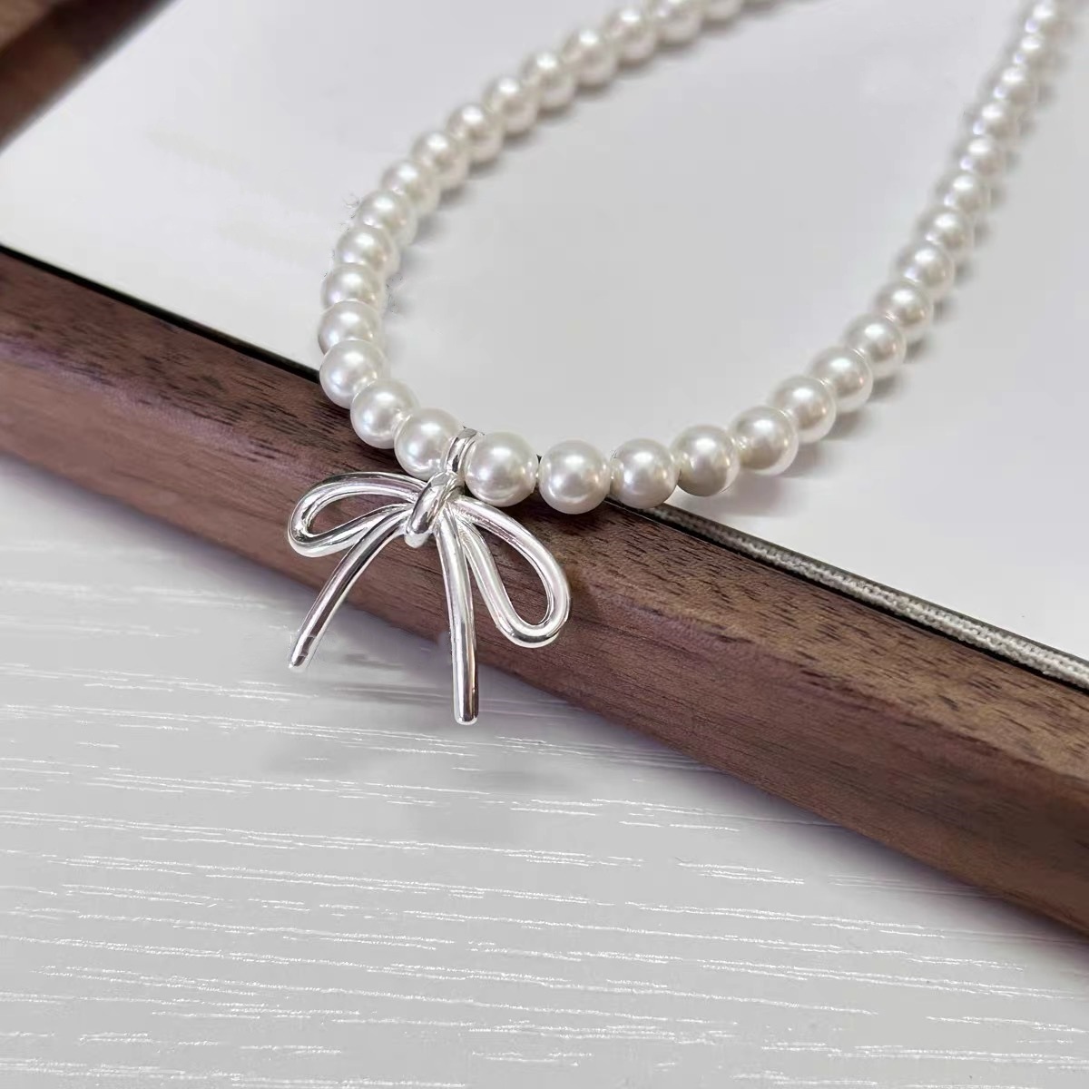 HLZ珍珠蝴蝶结项链蝴蝶结耳钉甜美气质轻奢小众锁骨链大气设计感详情6