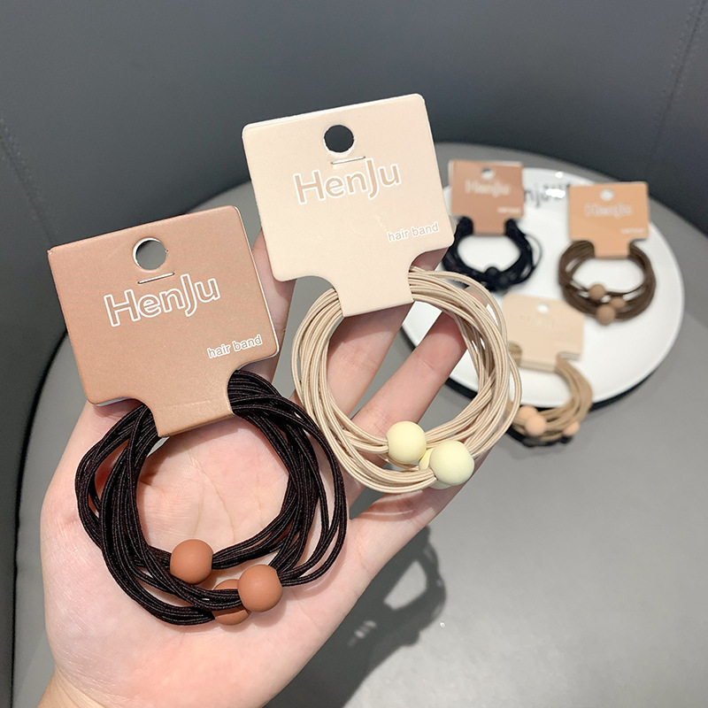 A new minimalist coffee-colored hair tie with a French retro and high-end look, a popular matte bead high-elasticity and durable hair tie Specification image