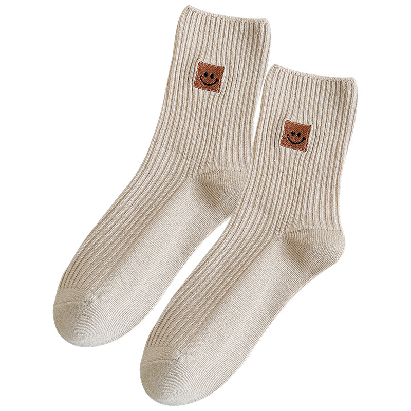 Sock street stall one-piece consignment, women's mid-calf socks with smiling face embroidery, spring and autumn solid-color cotton socks, Japanese-style double-needle women's long socks, Zhuji women's socks wholesale one-piece consignment Item Picture