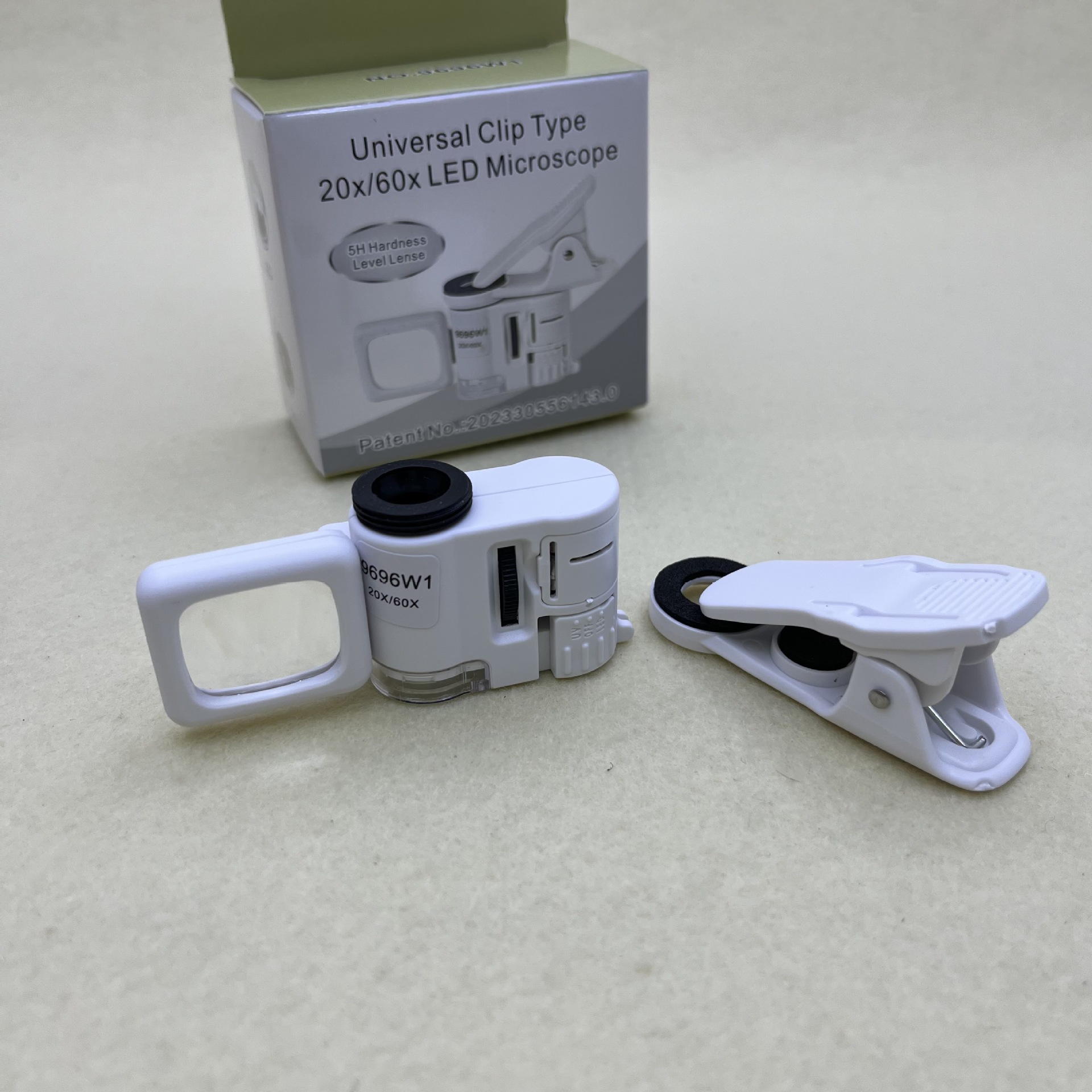 9696W1 Universal long Clip model 20x 60x mobile phone holder microscope with LED light source and UV purple light Application Scenario