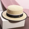 A white flat-topped straw hat with an M logo, a female summer outing sunshade beach hat, a model's catwalk performance, and a fashionable top hat Specification image