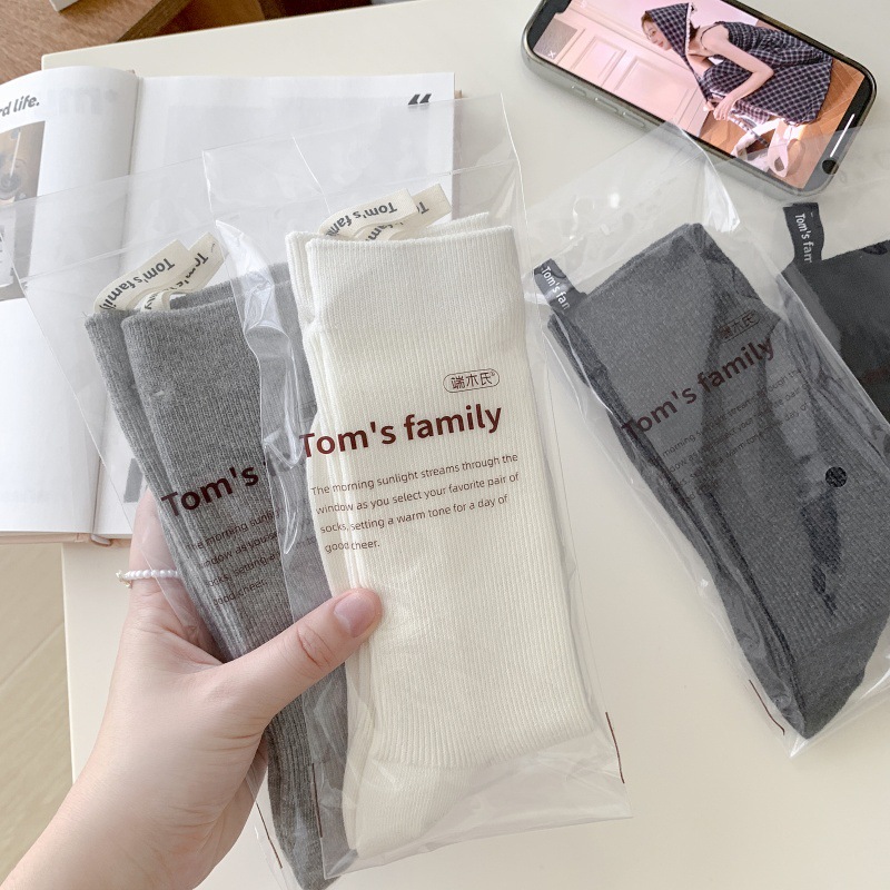 Sock stall one-piece consignment, followed by lettered cloth label socks for women, 2025 autumn new Korean style vertical mid-calf socks, solid color, versatile, pile pile socks for women, one-piece consignment