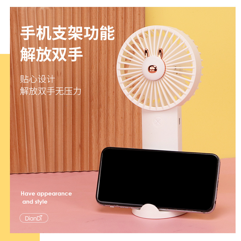 Drip fan, fresh cartoon phone stand, USB charging, portable handheld small fan with light, advertising gift Application Scenario