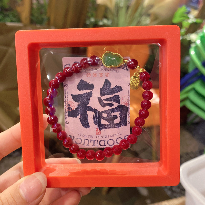 New Year's wealth-attracting bracelet, a niche design with a high-end feel, is available for wholesale. It's a big red New Year accessory for women details Picture