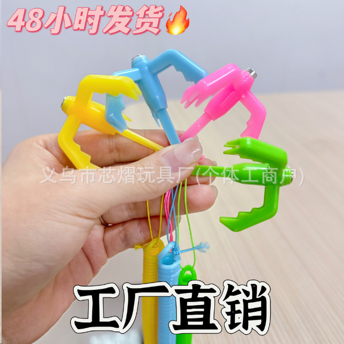 New trendy egg-shaped spring claw claw hook game prop, artist birthday gift, flying hook claw toy spring