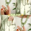 The peach holds a jade-like hand, twirling an ancient-style bracelet, mobile phone chain, Hanfu accessories, and is versatile. It plays with various objects and tassels details Picture