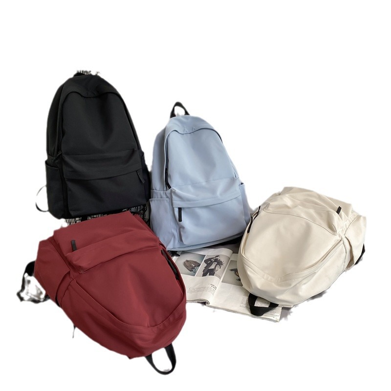 Mochila de viento japonés sin impresión para hombres y mujeres para estudiantes universitarios versión coreana de gran capacidad mochila de color sólido para estudiantes de secundaria y secundaria Item Picture