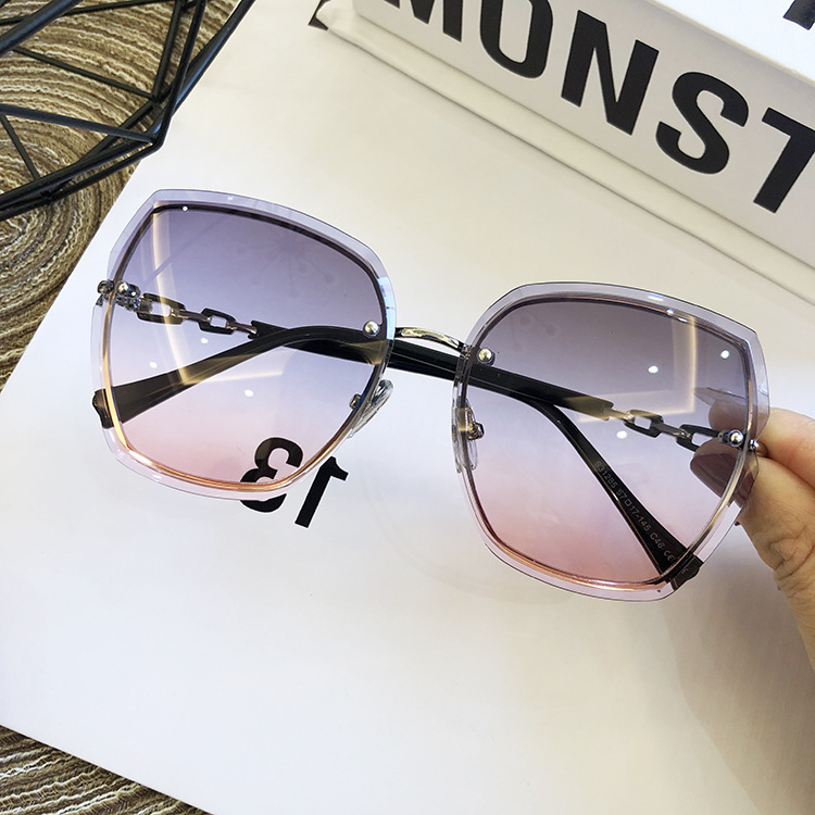 Wholesale of 21 new frameless sunglasses for women's fashion, large-framed trimmed round face UV protection sunglasses details Picture