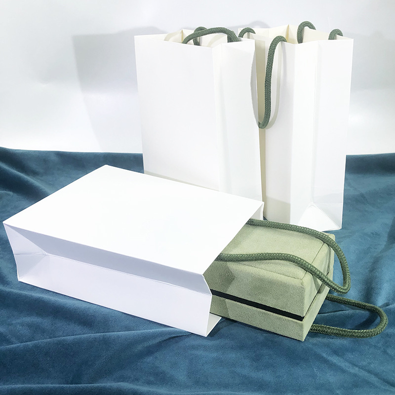 New trapezoidal personalized jewelry tote bag, the same style as four-leaf clover, white paper bag with V-shaped bottom and thickened, high-end jewelry bag details Picture
