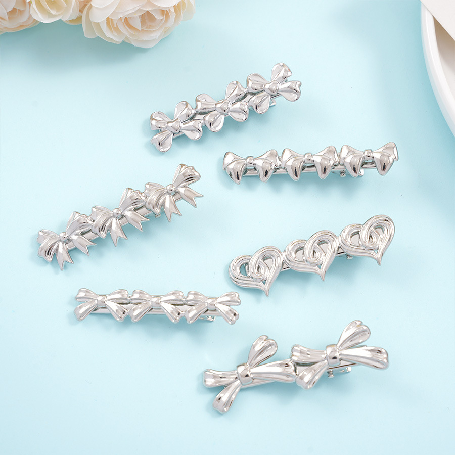 The new bow hair clips of the national trend series feature an InS-style niche design, hollowed-out heart-shaped duckbill clips, side hair clips and bangs clips Specification image