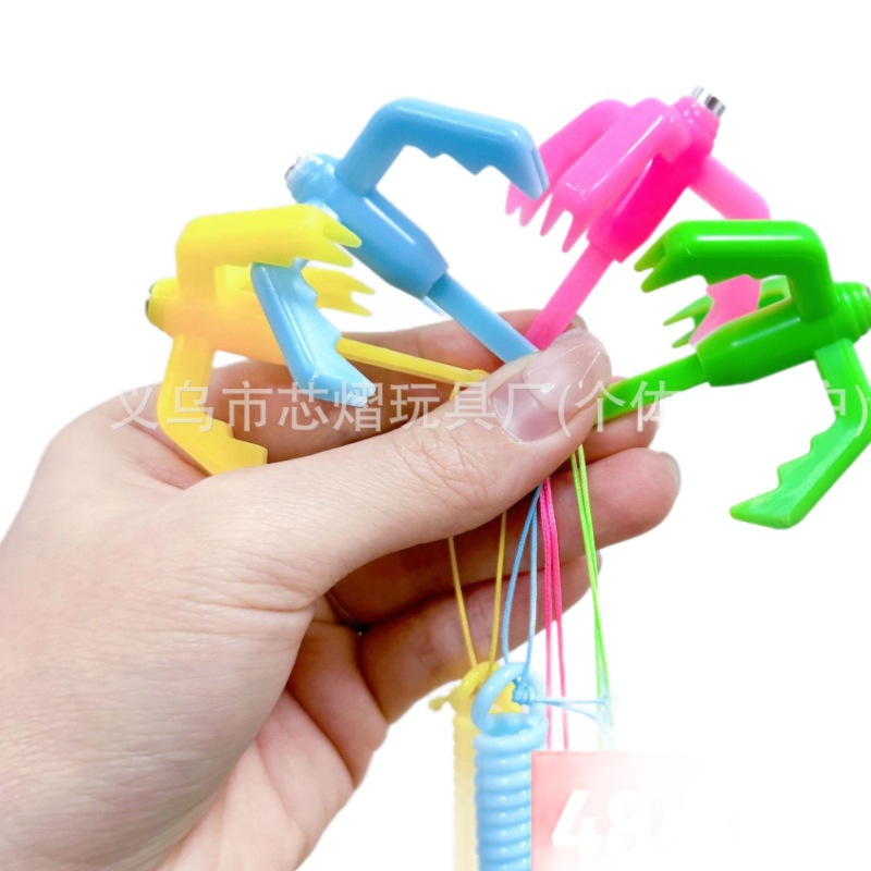 New trendy egg-shaped spring claw claw hook game prop, artist birthday gift, flying hook claw toy spring Item Picture