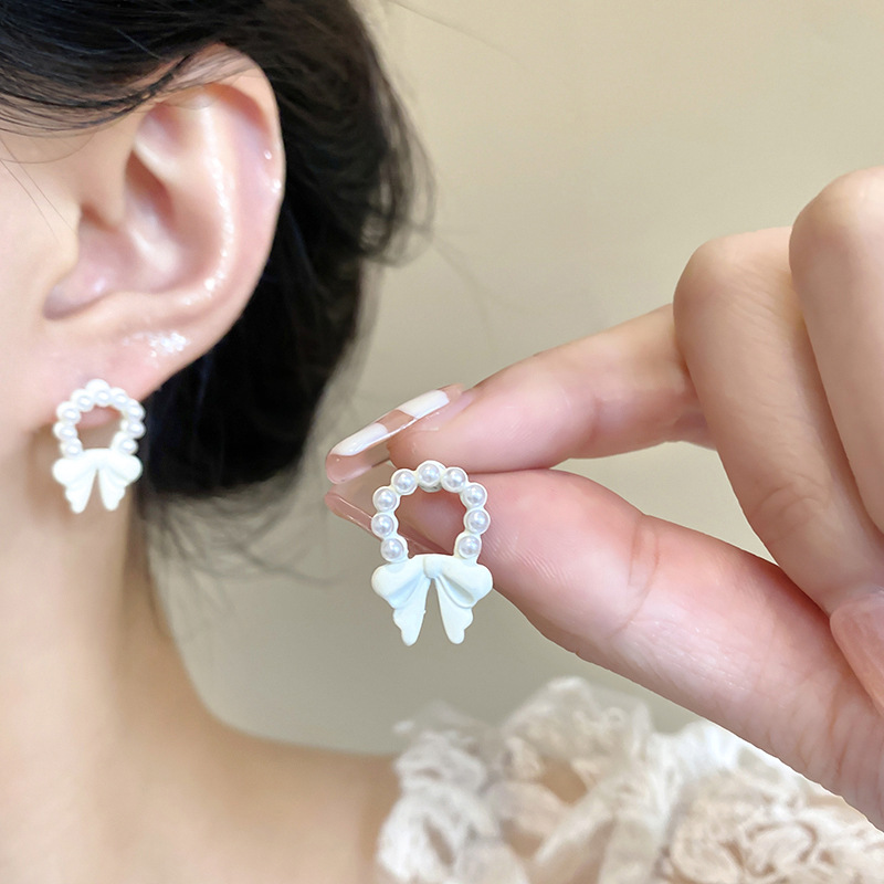 Ins Wind White Bow Pearl Earrings Female Sweet Temperament Super Fairy Earrings 925 Silver Needle Net Red Earrings Of The Same Style
