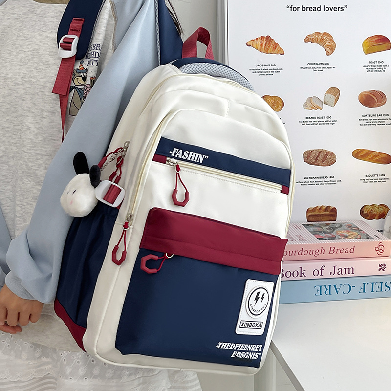 A lightweight and fashionable backpack for college students, a large-capacity men's color-blocking Instagram backpack for junior and senior high school students, a trend