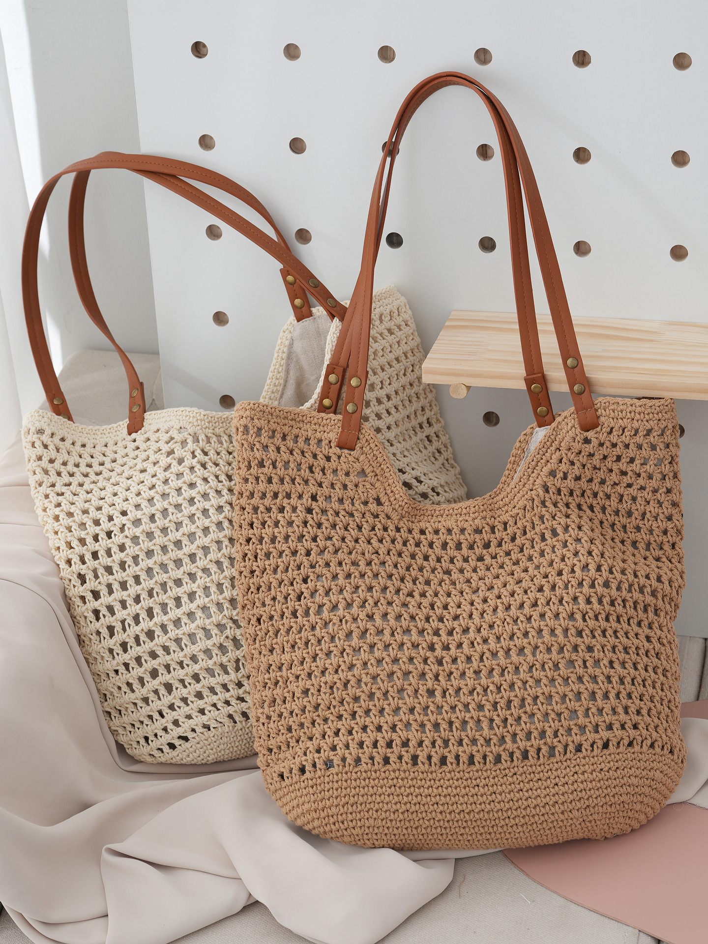 一件代发草编包2024夏季沙滩包休闲镂空网纹编织包轻便手提包包女