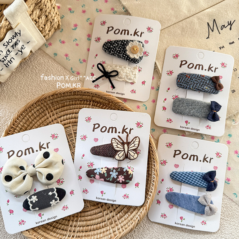 Korean-style fashionable, simple and high-end polka dot handcrafted fabric bow BB hair clip, cute and versatile hair accessory for girls Application Scenario