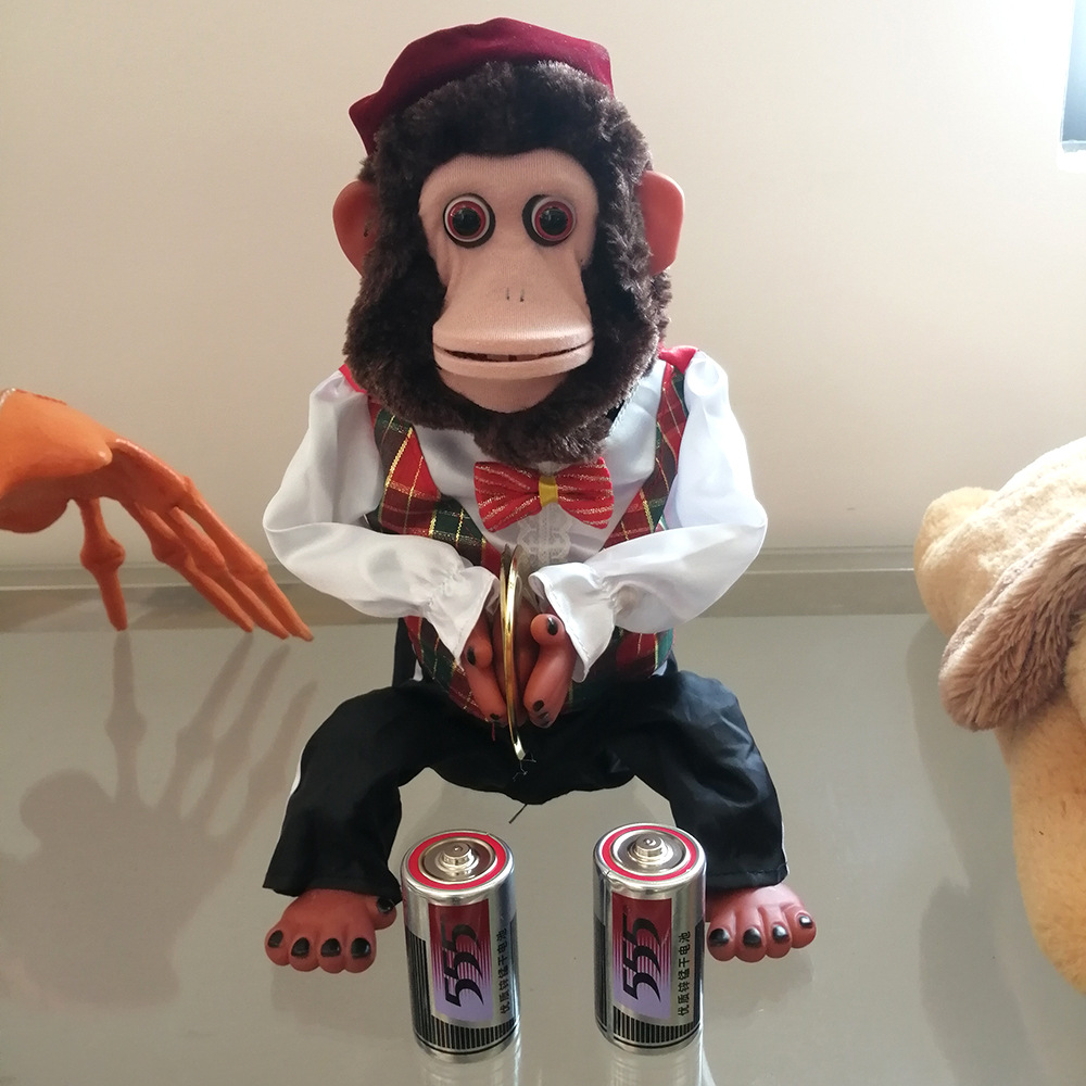 Children's monkey plush toys, percussion performance props, sound touch sensing electric toys for singing occasions Specification drawing