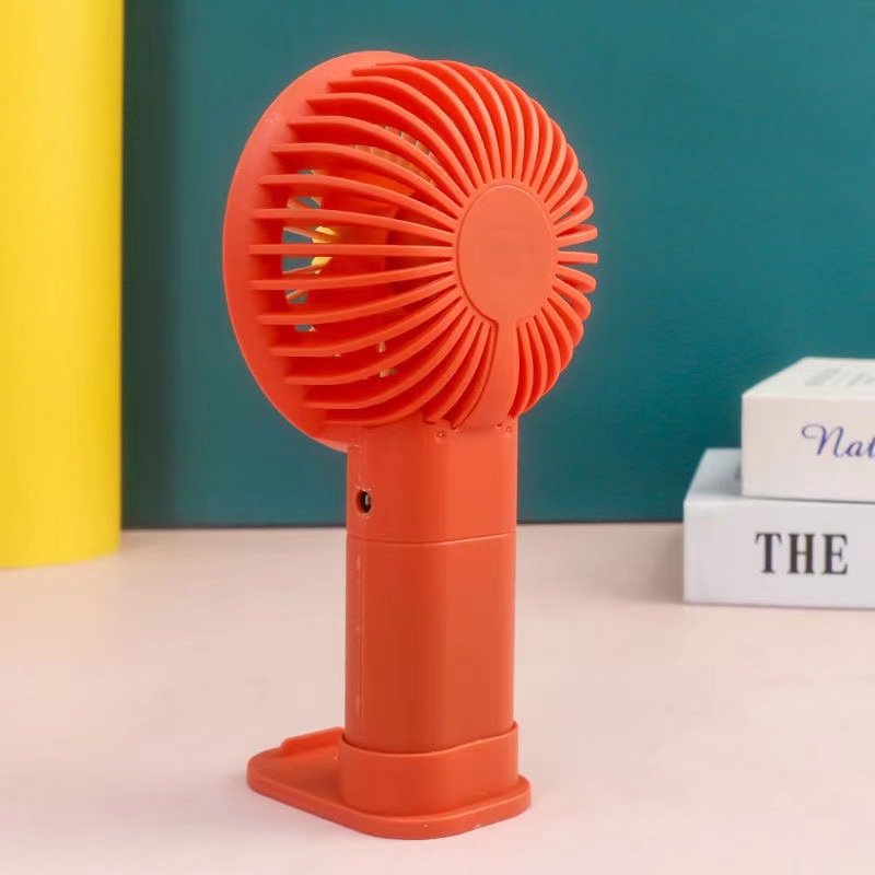 Desktop Stand Small Fan Handheld Portable Is A Fan Charging Flower Five-Leaf Travel Fan Carrying Phone Holder Application Scenario