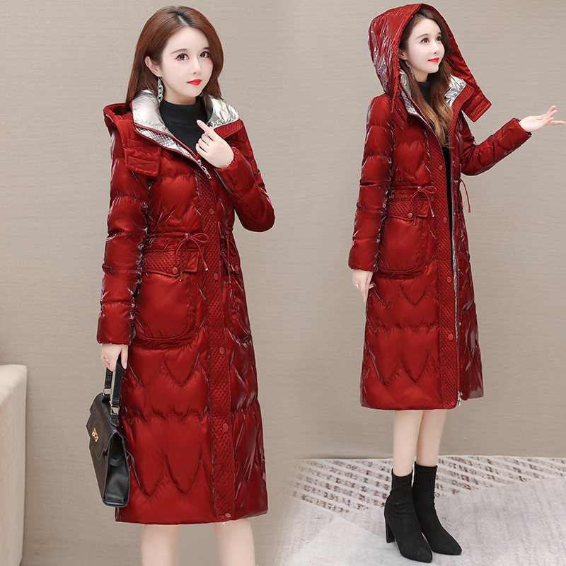A stylish and trendy hooded new down jacket for women in the winter of 2022, featuring a lace-up and slimming mid-length women's coat