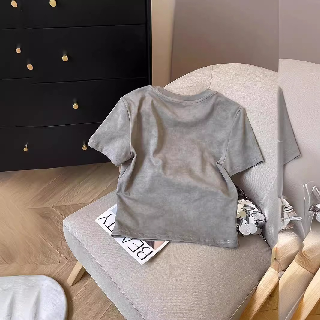 A unique short-sleeved T-shirt for women, a new summer style with a fitted shoulder and a Korean-style chic and high-end look, featuring a round neck and a straight shoulder details Picture