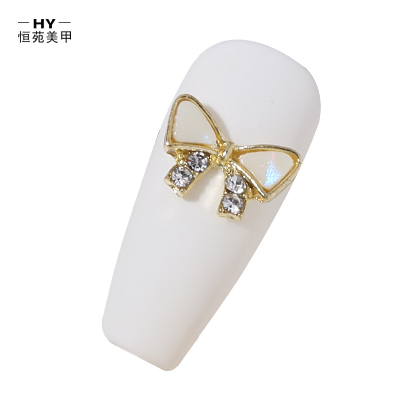 New alloy rhinestone bow, Japanese-style pearl super sparkling rhinestone drop pendant, popular nail art accessory Item Picture