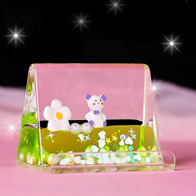 Creative liquid oil floating figurines, mobile phone stands, decorative items, birthday gifts, cartoon message bottles, oil drops, acrylic Application Scenario