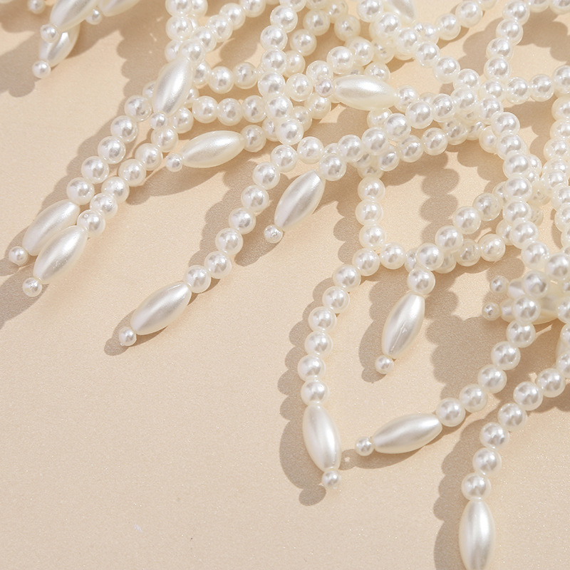 European and American cross-border light luxury retro hollowed-out body chain, hand-woven pearl shawl, teardrop tassel dress accessory Specification image