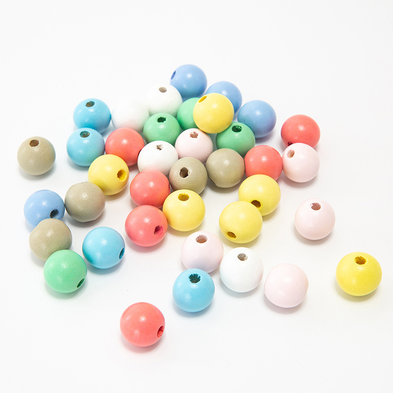 Factory direct supply of diy colored wooden beads, loose beads in stock, wholesale of children's bead materials, large-hole small wooden beads, candy colors Specification image
