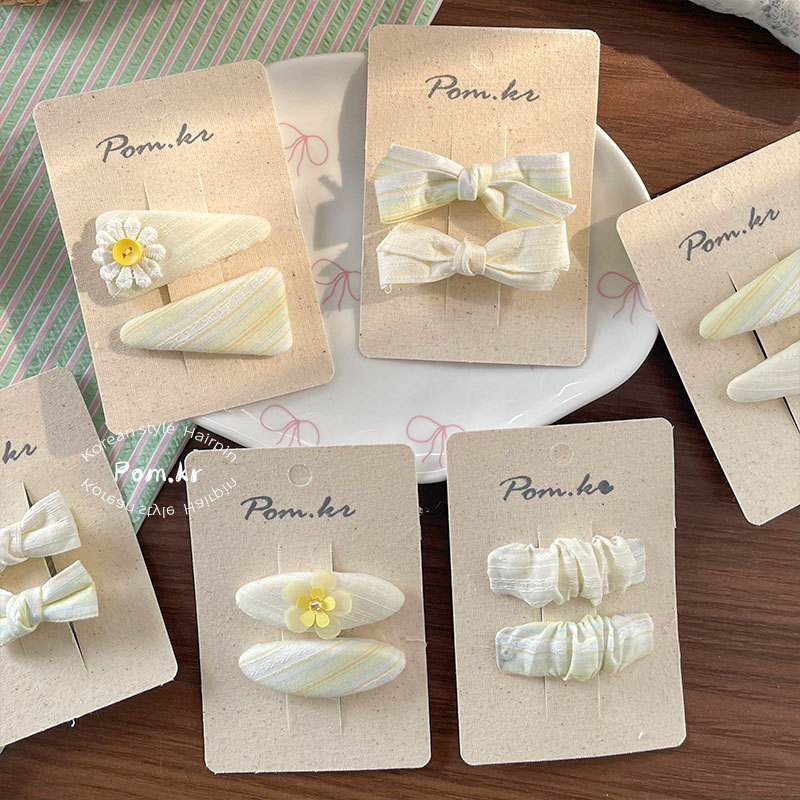 New Korean-style sweet cream-colored bow hair clips for girls, side bangs clips for girls, and fabric children's bye-bye clips details Picture