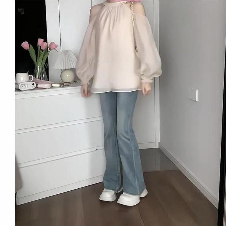 A trendy off-the-shoulder long-sleeved shirt for women in summer, featuring a gentle French style and a loose yet unique look