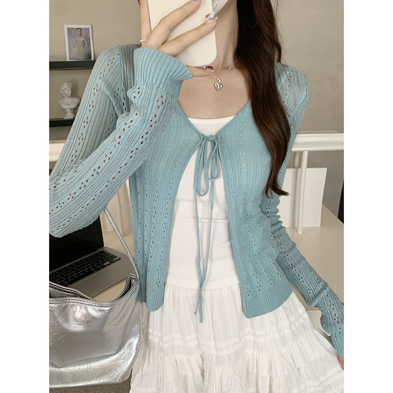 A Korean-style atmosphere, hollowed-out knitted cardigan for women in early autumn, with a slimming design and a halter top that exudes a unique charm. A complete set of top for this outfit Item Picture