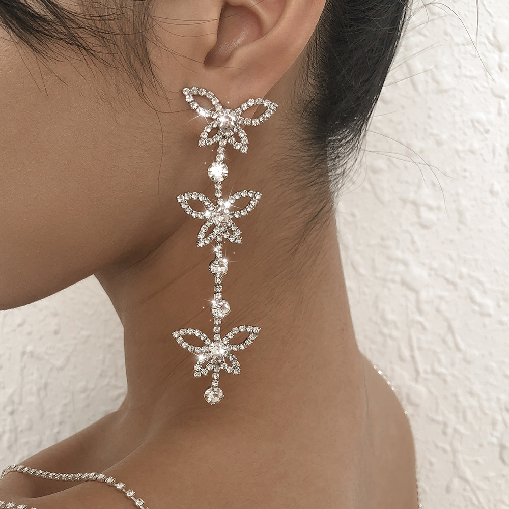 European and American cross-border butterfly tassel earrings, sparkling rhinestones, fashionable and beautiful diamond-encrusted chain earrings, claw chain welded accessories details Picture