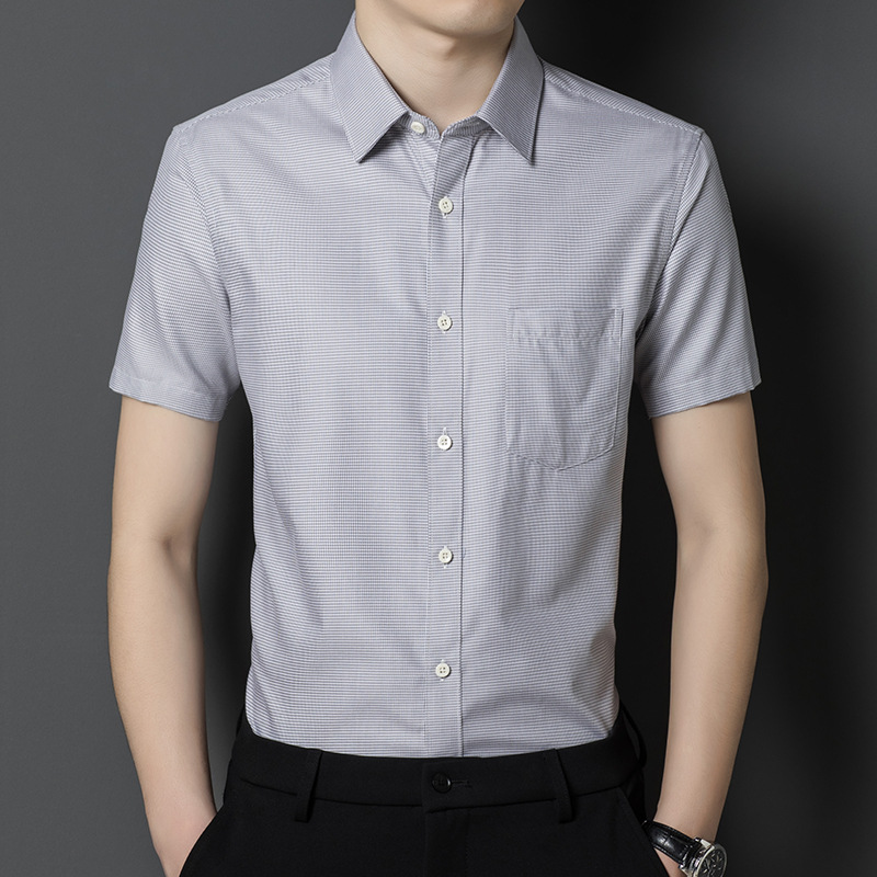 A new business style men's short-sleeved shirt for summer, a middle-aged fashion casual shirt with pockets, a thin solid color loose shirt details Picture