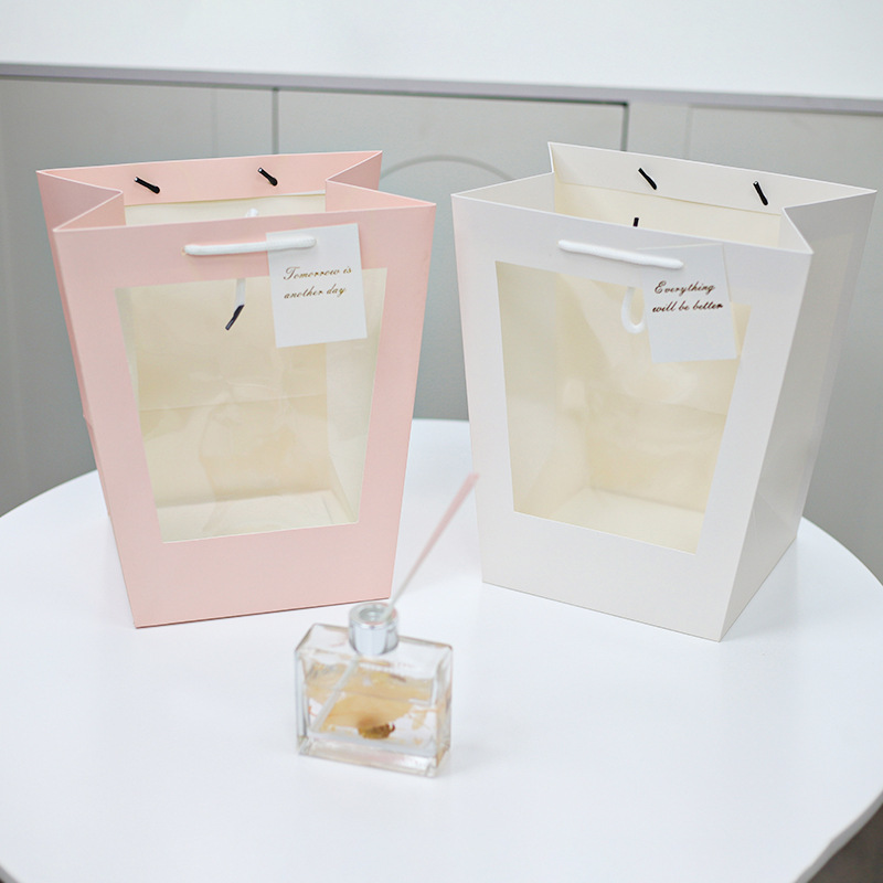 Wholesale of large cowhide trapezoidal handbags, transparent window bags, toy bags, showcase bags, flower packaging and gift bags Specification image